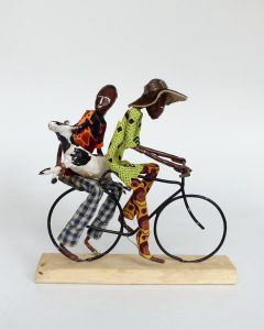 Uganda Kampala Dolls Pair on Bike Transporting Cow